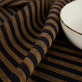 Brown Sugar & Black | Solino Home Amalfi Stripe Brown Sugar & Black Soft Woven Table Runner Layered With Dinnerware And Candles