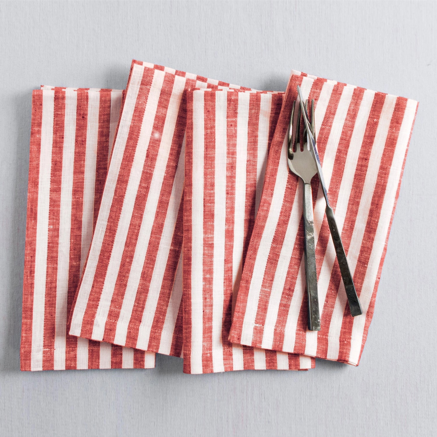 Amalfi Stripe Red & White Linen Dinner Napkins Folded For Product Display