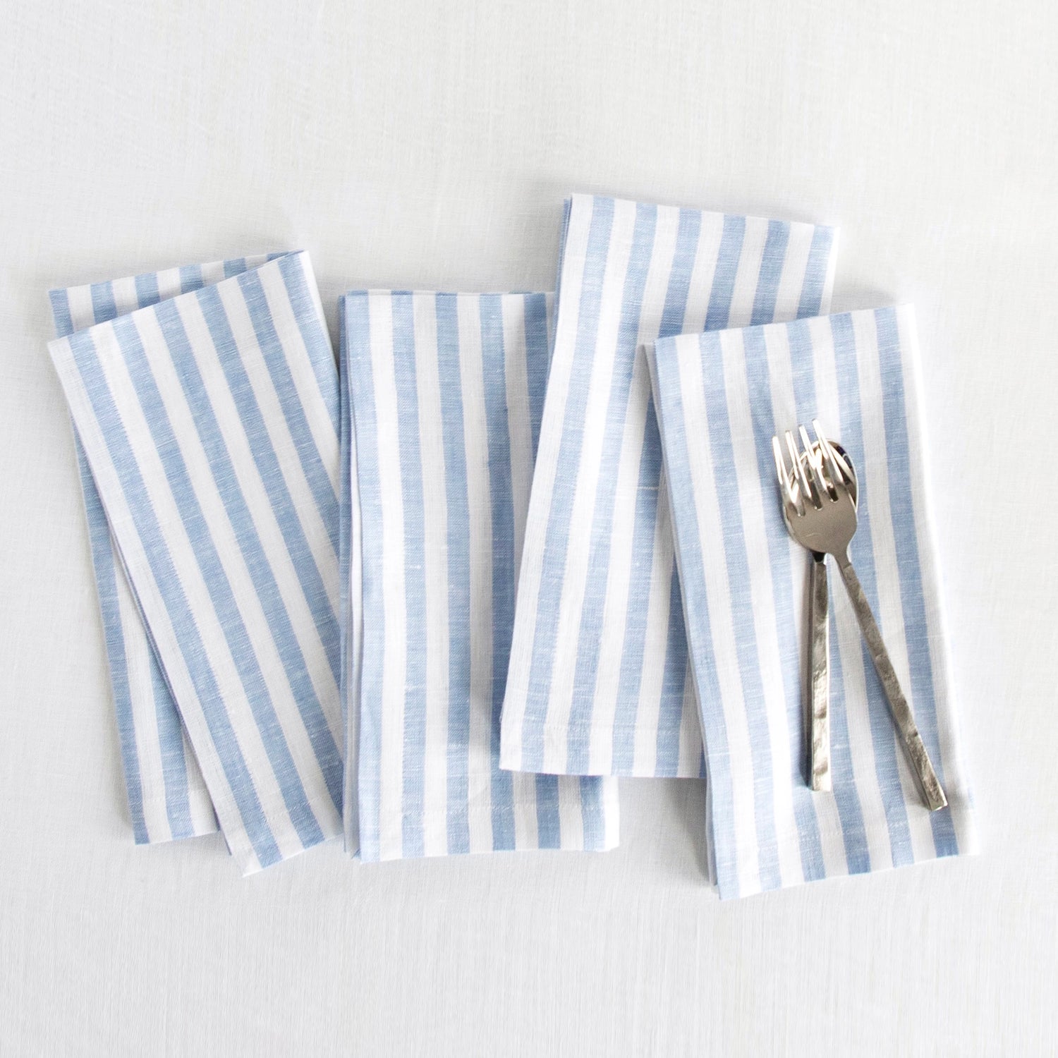 Amalfi Stripe Sky Blue & White Linen Dinner Napkins Folded For Product Display