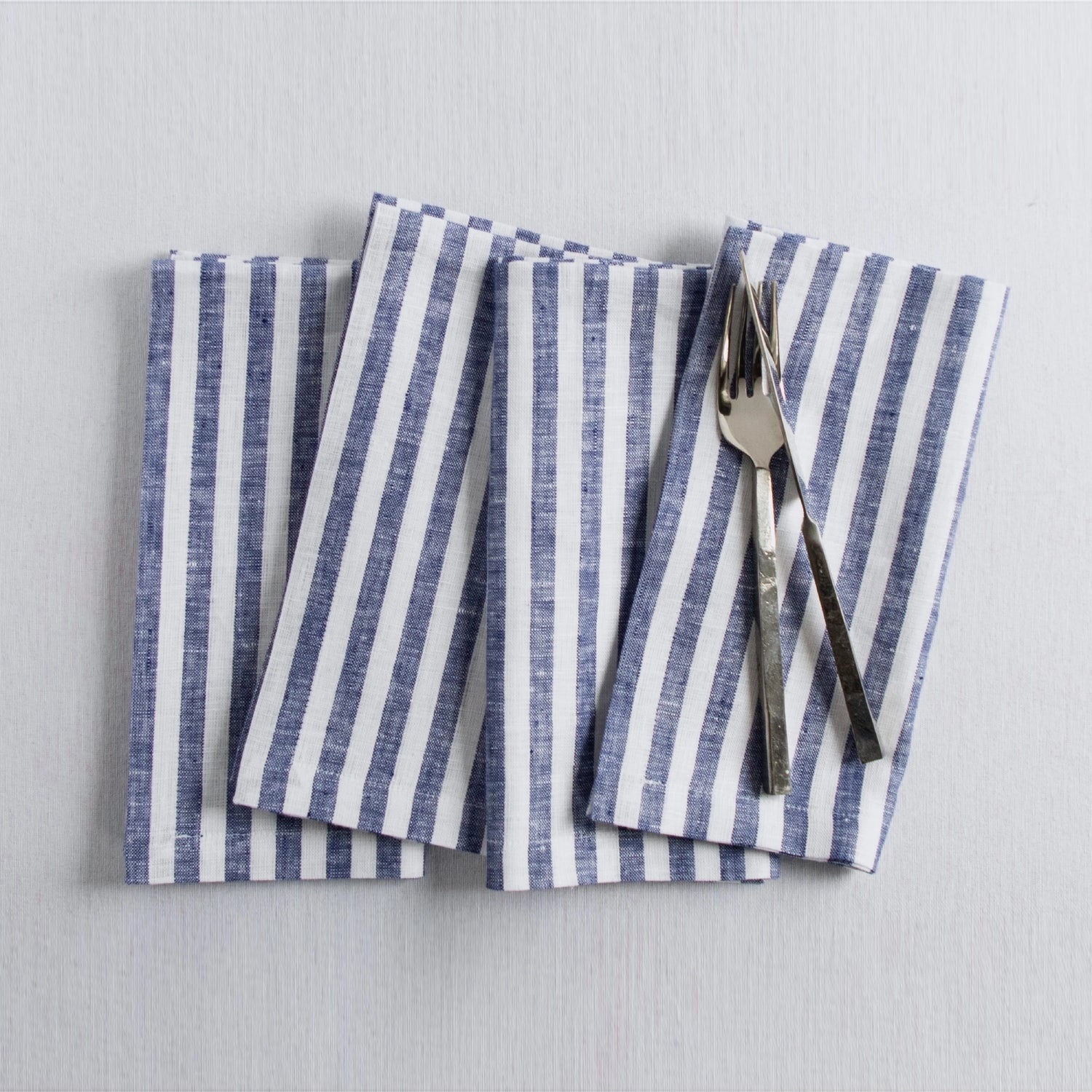 Amalfi Stripe Navy & White Linen Dinner Napkins Folded For Product Display