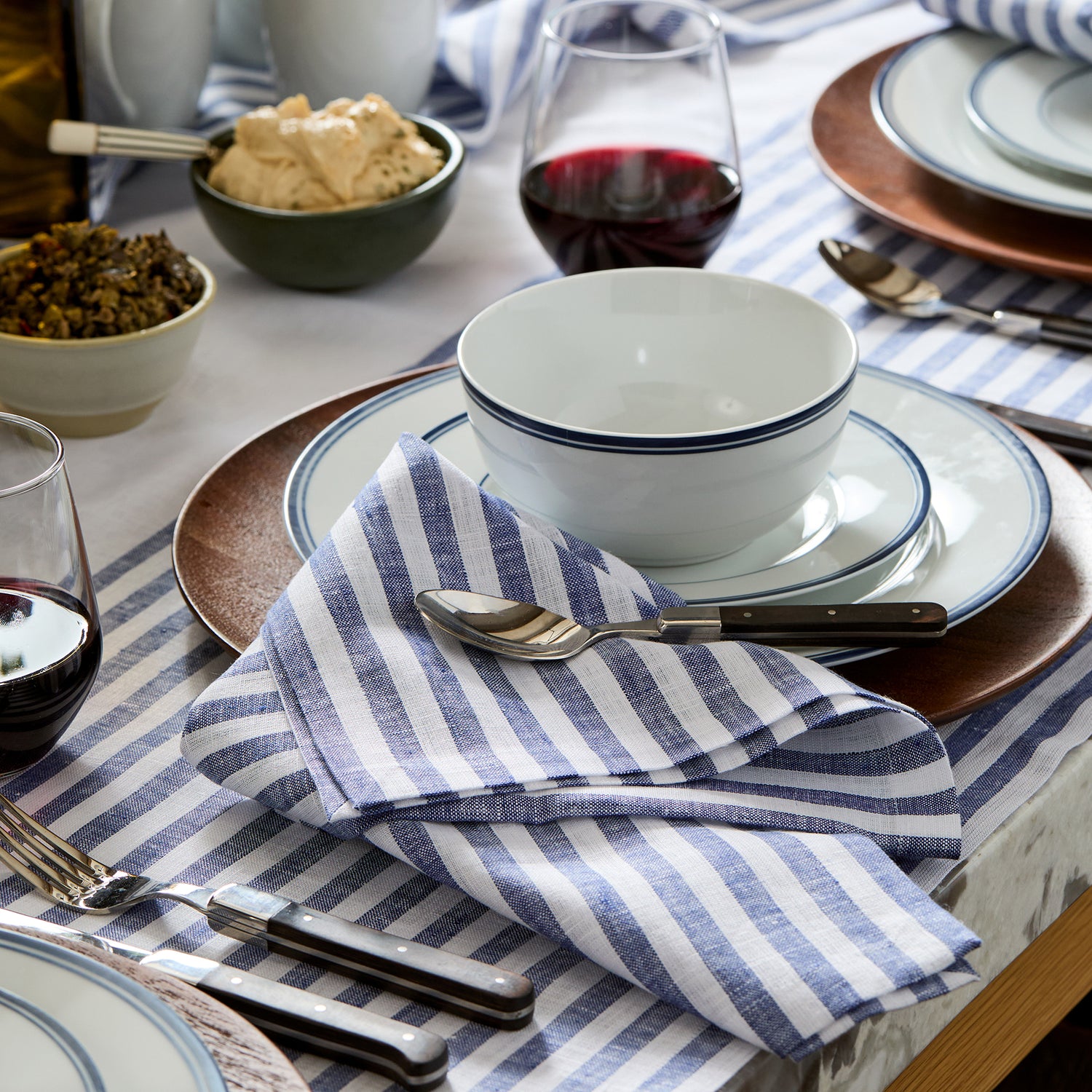 Amalfi Stripe Navy & White Linen Dinner Napkins Styled On An Elegant Dining Table